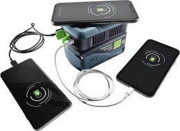 A portable battery pack charges three smartphones using both wireless and wired connections.