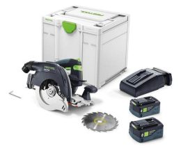 Cordless circular saw kit with two batteries, a charger, a spare blade, a hex key, and a storage case.